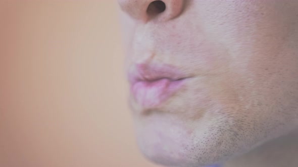 Man Cleaning His Teeth Using His Lips alt