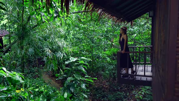 Cute Asian Girl Chilling in Front of a Treehouse in Slow Motion Thailand alt