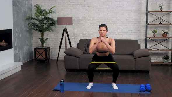 Fit Woman in Sportswear Does Sports Training Workout on Fitness Yoga Mat at Home alt