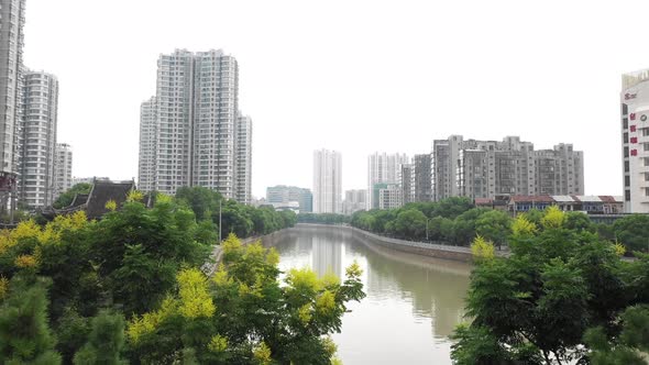 Flying Above River In China City