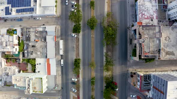 Aerial View of the Street Intersection with Cars Driving Down the Street alt