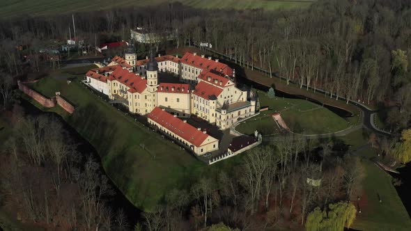 Flying Over the Nesvizh Castle the Park Around the Castle and the Lake Aerial Video of Nesvizh
