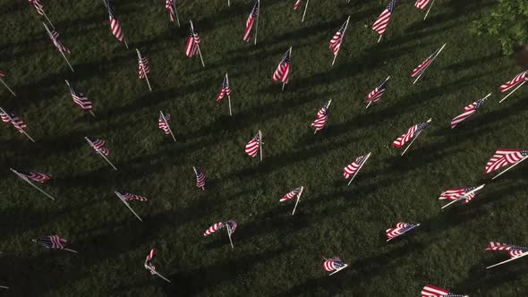 Field of American Flags flowing to honor fallen heroes and soldiers on Memorial Day weekend. Aerial alt