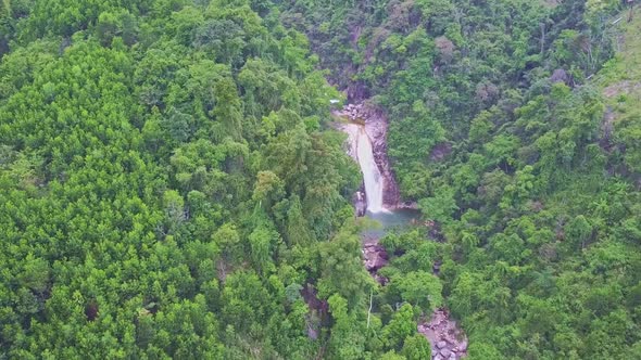 Drone Shows Mountain River Among Jungle in Highland alt