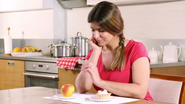 Young Woman Chooses an Apple, Not a Cream Cake