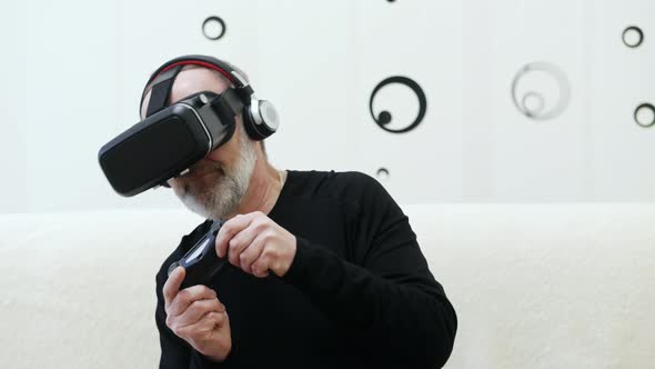 Adult Man Using Virtual Reality Glasses at Home Journey in the Metaverse alt