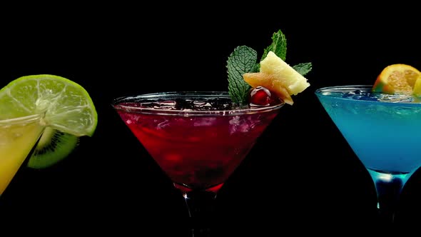 Passing Red, Yellow And Blue Cocktails alt