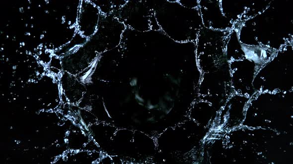 Super Slow Motion Shot of Water Splash Isolated on Black Background at 1000Fps alt