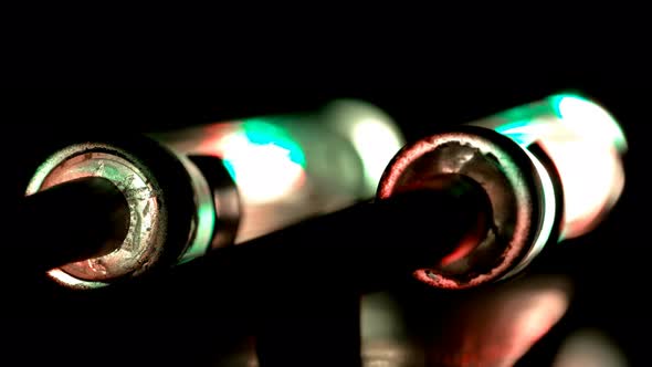 Two Glowing Flasks, One Blinking Red. It Looks Like a Device with Two Safety Power Blocks, One alt