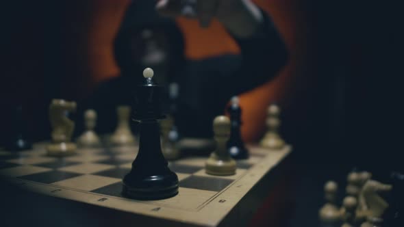 Business Challenge Competition Winner and Loser Concept. Man in Hoodie Playing Chess.  alt