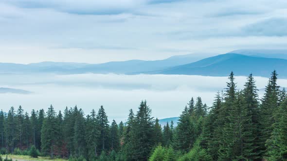 White Clouds Move Slowly Along Autumn Mountain Forest at Hill During Rain alt