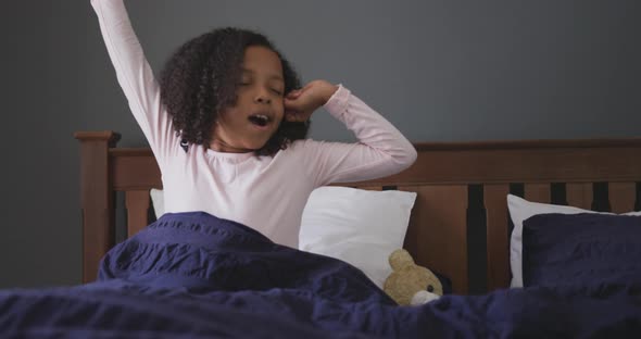 African american girl waking up and yawning alt