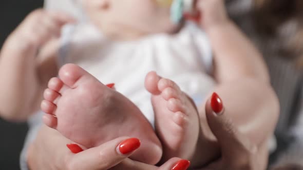 Baby Feet in Mother Hands