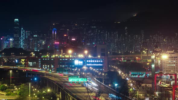 City Skyline Views at Night of the Hong Kong Headlights of Car Traffic alt