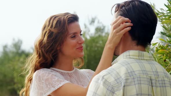 Romantic couple embracing each other in olive farm 4k alt