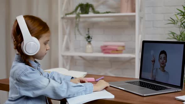 Little Child Girl Using Laptop Computer for Studying Online E-learning System