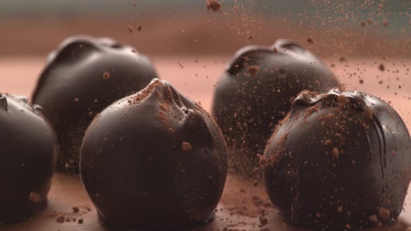 Chocolate powder falling onto truffles in super slow motion.  Shot on Phantom Flex 4K high speed cam