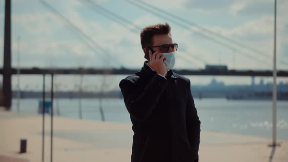 Businessman Walking In Face Mask On Coronavirus Lockdown.Coronavirus Lockdown Self Distance Pandemic alt