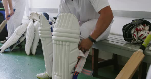 Cricket players preparing in the locker room alt