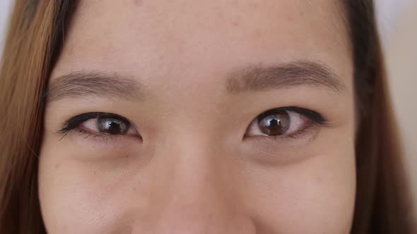 Close Up of Middle Eastern Young Woman Face The Girl Has Beautiful Brown Eyes She Smiles Frowns alt