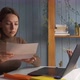 Woman Sitting at Desk Take Out Official Notice From Envelope Read Great Positive Incredible News - VideoHive Item for Sale