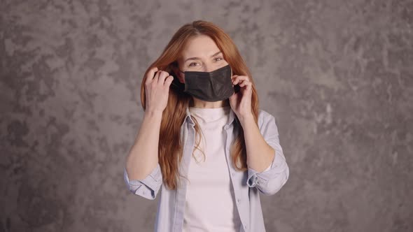 Ginger Female Posing in Medical Mask alt