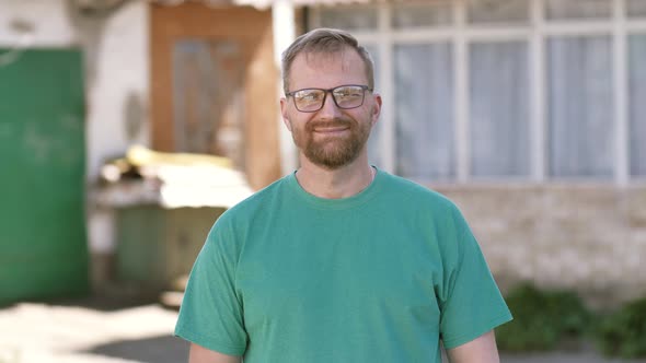 Portrait of a Young Happy Businessman Looking at the Camera alt