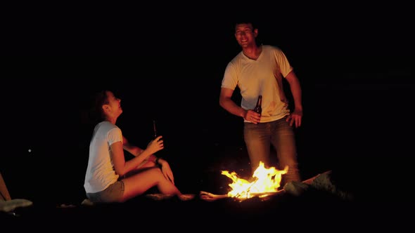 adventurous couple are setting up campfires and enjoying the beauty of nature