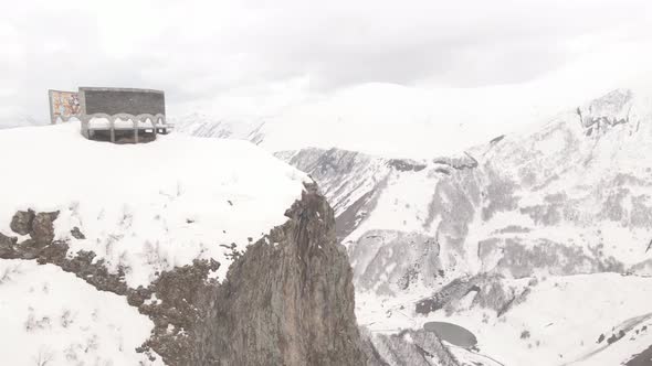 Gudauri, Georgia - April 17, 2021: Aerial view of Russia–Georgia Friendship Monument alt