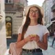 Woman Walking on the City Street and Looking in her Smart Phone - VideoHive Item for Sale