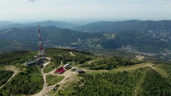 Aerial shot of Polish mountains in the Silesian Beskid. Skrzyczne hill, gsm tower transmitter and to alt