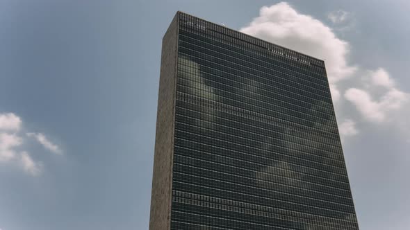 UN building facade with clouds in Manhattan - New York - USA