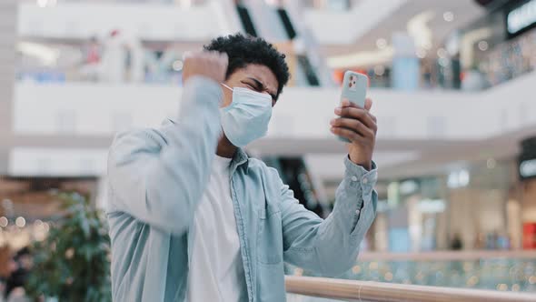 African American Man Wearing Medical Protective Mask Indoors Quarantine Covid Pandemic Looking at alt