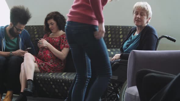 Doctor consulting patient in hospital waiting room