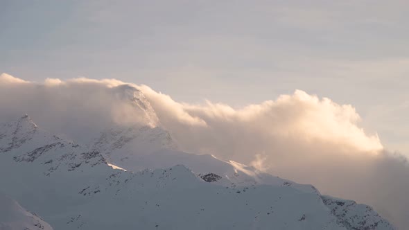 Sunset Timelapse High in the Mountains Cloudy Front of Cyclone Cloud Flows Through the Rocky Ridge alt
