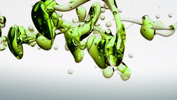 Transparent Cosmetic Green Oil Bubbles and Shapes on White Background