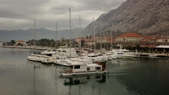 Aerial view of man and a woman sitting and drinking tea sitting on a boat alt