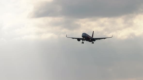 A Passenger Plane in the Cloudy Sky alt