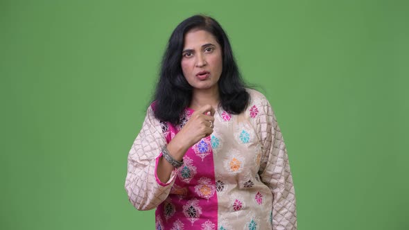 Mature Beautiful Indian Woman Looking Shocked and Nodding Head No alt