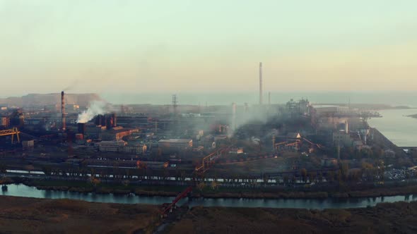 Metallurgical plant. Evening time. Environmental pollution 