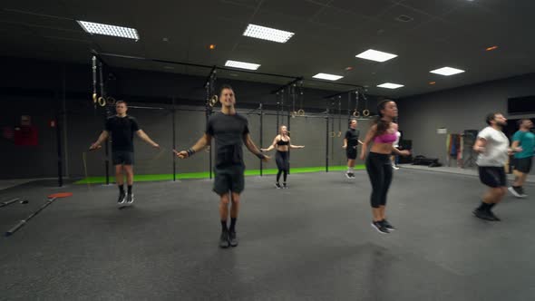 Group of people skipping rope at gym alt