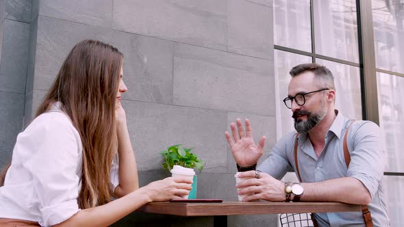 Confident woman enjoy dating with her boyfriend in the coffee shop outdoor zone