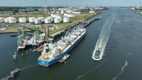 Bulk Carrier Ship at Port Offloading Cargo and Commodities alt