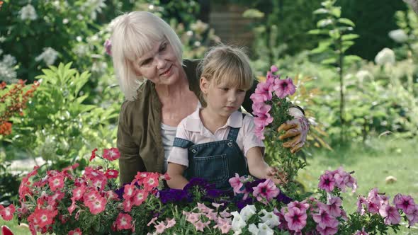 Grandmother and Granddaughter in Garden alt
