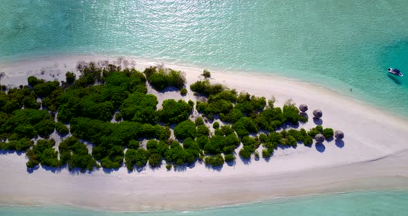 Luxury fly over tourism shot of a paradise sunny white sand beach and turquoise sea background in co alt