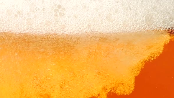 Beer Is Poured in a Glass. Closeup. Slow Motion alt