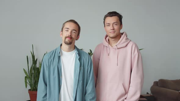 Two Lgbt Men are Standing Together and Looking at the Camera alt