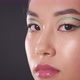 Semi Profile Portrait of Young Asian Lady with Creative Green Arrows on Eyes Looking at Camera Empty - VideoHive Item for Sale