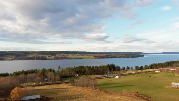 Beautiful Swedish Countryside River Lake Town Farm Fields Near Östersund, Sweden. 4K Drone. alt