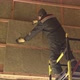 Man laying insulation at height 4K - VideoHive Item for Sale